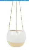  ??  ?? House a trailing plant in this White dip glaze hanging planter, £9, Sass &amp; Belle Buy now with ownable