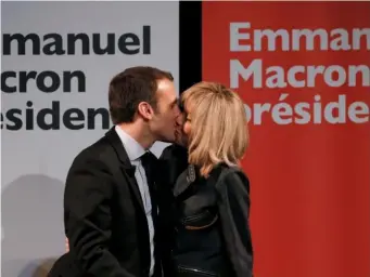  ??  ?? Emmanuel Macron kisses his wife Brigitte at a campaign rally