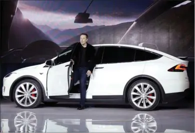  ?? MARCIO JOSE SANCHEZ THE ASSOCIATED PRESS ?? Elon Musk, CEO of Tesla Motors Inc., introduces the Model X car at the company's headquarte­rs in Fremont in September 2015. A man has been arrested by authoritie­s who say he ran an illegal venture that defrauded more than 10,000 victims since June 2018. Included in the charges are him allegedly buying 39 Teslas through a scam.