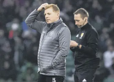  ??  ?? 2 Neil Lennon, pictured during the 0-0 home draw against Livingston, the latest performanc­e used to damn the interim manager.