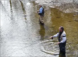  ?? ?? Mark McAllister and his uncle Wayne McAllister enjoy some fly fishing along Ridley Creek Tuesday morning. Mark said he likes to fish regularly in his retirement.