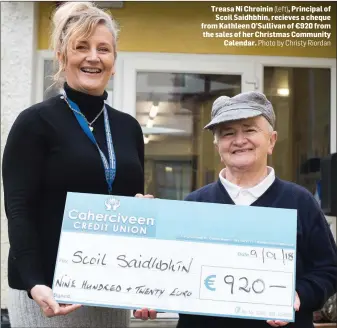  ?? (left), Photo by Christy Riordan ?? Treasa Ni Chroinin Principal of Scoil Saidhbhin, recieves a cheque from Kathleen O’Sullivan of €920 from the sales of her Christmas Community Calendar.