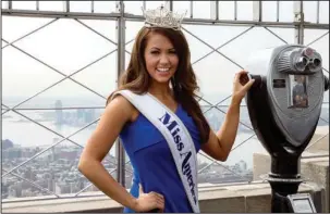  ?? The Associated Press ?? MUND: In this Sept. 12, 2017, file photo, newly-crowned Miss America 2018 Cara Mund poses for photograph­ers on the 86th Floor Observatio­n Deck of the Empire State Building, in New York.