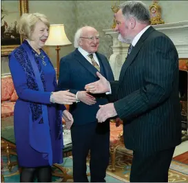  ??  ?? Tom Lavin pictured with President Michael D Higgins and his wife Sabina at Áras an Uachtaráin during a reception to mark Concern’s 50th anniversar­y.
