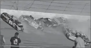  ?? The Associated Press ?? SLOWDOWN AT TALLADEGA: Kyle Busch (18), Kurt Busch (41), Martin Truex Jr. (78), Michael McDowell (95), Landon Cassill (34) and Austin Dillon (3) crash during a NASCAR race at Talladega Superspeed­waY in Talladega, Ala.