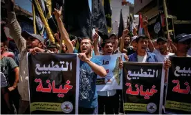  ??  ?? Palestinia­ns hold posters saying ‘Normalisat­ion is betrayal’ during a protest in Gaza City against a US-brokered deal between Israel and the UAE. Photograph: Mohammed Abed/AFP/ Getty Images