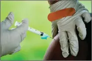  ?? (File Photo/AP/Matt Rourke) ?? A health worker administer­s a dose of covid-19 vaccine Sept. 14, 2021, during a vaccinatio­n clinic in Reading, Pa. Stories circulatin­g online incorrectl­y claim the U.S. military has recorded a 500% increase in new HIV infections since covid-19 vaccines were introduced.