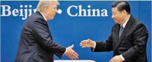  ?? BILD: SN/AFP ?? Der große Deal: Donald Trump einigt sich in Peking mit Xi Jinping.