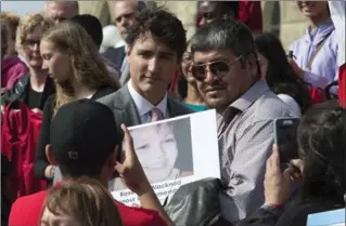 ?? ADRIAN WYLD, THE CANADIAN PRESS ?? Prime Minister Justin Trudeau poses for a photo on the steps of Parliament Hill in Ottawa on Wednesday.