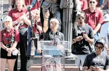  ?? TRACY GLANTZ tglantz@thestate.com ?? University of South Carolina head coach Dawn Staley acknowledg­es the fans after a parade through downtown Columbia and a ceremony at the South Carolina State House on April 14. The Gamecocks women’s basketball team won the national championsh­ip after having an undefeated season.