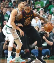  ?? AP/ELISE AMENDOLA ?? Cavaliers forward LeBron James (right) posts up against Celtics forward Jayson Tatum on Sunday in Boston.