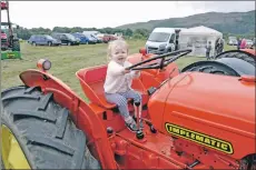  ?? 17_T32_LornShow12 ?? Grace Gunn enjoyed sitting in her great uncle’s tractor when she visited Lorn Show.