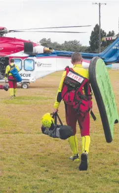  ?? Picture: DAVID ANTHONY ?? RESPONSE: A crew of fire and rescue officers set out to the site on the North Johnstone River last week.