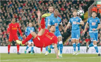  ?? — Reuters ?? Liverpool’s Dejan Lovren shoots at goal.