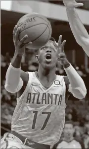  ?? Brandon Dill / AP ?? Atlanta’s Dennis Schroder goes up for a shot during the second half vs. Memphis.