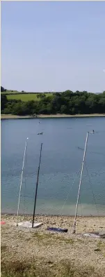  ??  ?? > A windless day at Llangedfed­d Reservoir. Picture taken by Phil Simmons of Old St Mellons