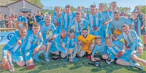  ?? ?? East Craigie celebrate their cup success following the comprehens­ive triumph over Tayport.