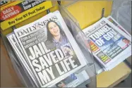  ?? Mark Lennihan / Associated Press ?? The Daily News will cut half of its newsroom staff, saying it will focus more on digital news.