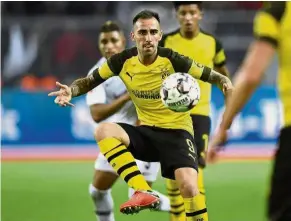  ?? — AP ?? Perfect debut: Dortmund’s Paco Alcacer cushioning the ball during the Bundesliga match against Eintracht Frankfurt in Dortmund on Friday.