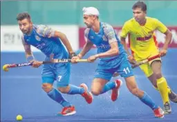  ?? AP ?? India's Manpreet Singh (left) and Mandeep Singh (centre) in action against Sri Lanka during a Pool A match on Tuesday.