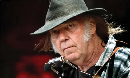  ?? Photograph: Nils Meilvang/EPA ?? Neil Young performing in 2016.