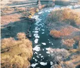  ??  ?? HEALTH HAZARD: Foam (indicating raw sewage) pours down the Rietspruit into the Vaal River.