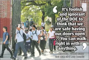  ??  ?? OPEN-&-SHUT CASE: Students exit Franklin K. Lane HS on the Brooklyn/Queens border, one of many where principals can’t lock entrances per a longstandi­ng DOE rule.