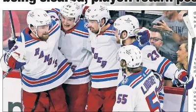  ?? Getty Images; AP ?? TOGETHER AGAIN: Filip Chytil (center), who has been out since January with a suspected concussion, was a full participan­t in practice on Friday after being medically cleared. “Just to see him back healthy and happy, I think that’s the biggest thing for everyone,” Jacob Trouba said.