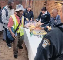  ?? Picture: SAKHILE NDLAZI ?? TREAT: Hatfield car guards queue for meals before receiving Father’s Day goodie bags from the police yesterday.