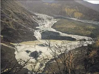  ?? Joel Angel Juárez Associated Press ?? MUD AND DEBRIS f low down charred hills in Ventura after an El Niño- fueled storm in 2015.