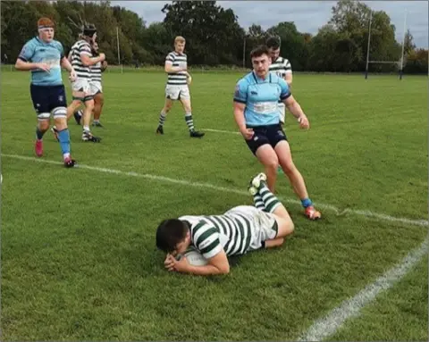  ??  ?? Nick Quirke crosses for his second try for Greystones in their defeat to MU Barnhall last weekend.