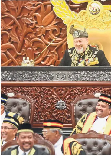  ??  ?? Pleasant start: Sultan Muhammad V smiling before the Royal Address during the opening of the first session of the 14th Parliament.