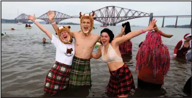  ??  ?? These poor souls were misled into believing that the warm spa waters of the Firth of Forth at this time of year could cure all ills. However, the so-called Loony Dook at South Queensferr­y saw them become hysterical as their hair changed colour and their bodies grew kilts.