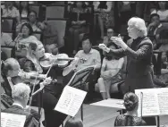  ?? PHOTOS BY WANG XIAOJING / FOR CHINA DAILY ?? Right: Pacific Symphony performs under the baton of