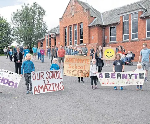  ??  ?? CAMPAIGN: Parents, children and councillor­s who gathered to celebrate the Scottish Government decision this year.