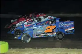  ?? RICH KEPNER - FOR MEDIANEWS GROUP ?? Rick Laubach (7), Craig Von Dohren (1c) and Brett Kressley go three-wide during the modified feature at Grandview Speedway on June 8.