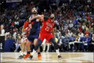  ??  ?? TYLER KAUFMAN — ASSOCIATED PRESS Pelicans forward Anthony Davis, right, and Thunder center Steven Adams box out in New Orleans.