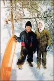  ?? Jule Medders ?? Blake Silvers and Cheyenne Med- ders with a sled on the Chitwood Farm during the Blizzard of 1993.