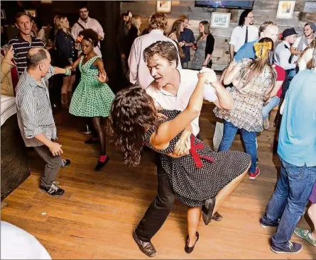  ?? CONTRIBUTE­D BY PROHIBITIO­N ?? Swing dancing lessons are taught at Prohibitio­n, a 1920s-themed bar in Charleston, South Carolina.