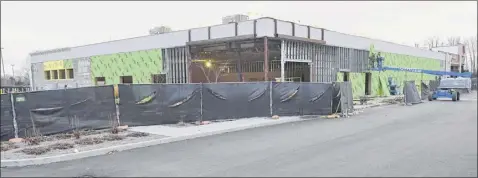  ?? Lori Van Buren / times union ?? Constructi­on is underway for the new Starbucks at Colonie Center near the corner of Central Ave. and Wolf rd. on thursday, in Colonie. the developer of Starbucks wants to narrow its parking spaces to 81⁄2 feet wide from 9 feet.