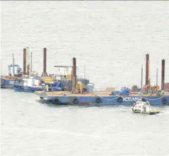  ?? GETTY IMAGES/ FILES ?? Two barges conduct seismic tests in the St. Lawrence River off Cacouna last fall in preparatio­n of an oil terminal being built in the area. Concerns over whales have now killed that plan.