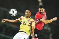  ?? AFP ?? Colombia’s Jose Heriberto Izquierdo engages in an aerial duel with Egypt’s Sam Mursy during a friendly in Bergamo on Friday.