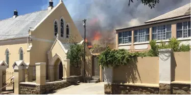  ?? CITY OF CAPE TOWN ?? PART of the Holy Cross Primary school, in Walmer Estate, was engulfed by flames yesterday. |
