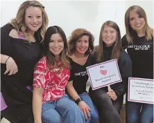  ??  ?? FOR GOOD CAUSE: Gretta Monahan, second from left, and her staff will participat­e in Sunday’s HAIRraisin­g event to raise money for the new Heart Center at Children’s Hospital.