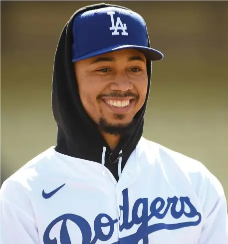  ?? GETTY IMAGES ?? MOOKIE, WE HARDLY KNEW YE: Mookie Betts of the Los Angeles Dodgers answers questions from the media at Dodger Stadium on Wednesday in Los Angeles.