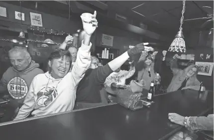  ?? PHOTOS SAM UPSHAW JR./COURIER JOURNAL ?? Janette Mercer joins regular patrons at the Come Back Inn as they toast owner Cathy Zachari during a private party Sunday. The restaurant closed after Zachari had operated it for over a decade.