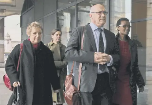  ??  ?? 0 From left, Caroline Thomson, chair of Oxfam’s trustees, Mark Goldring and Winnie Byanyima arrive at Portcullis House to face MPS over the Haiti sex scandal