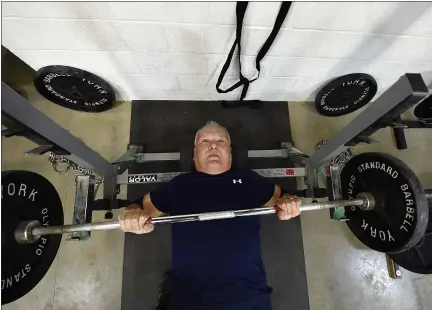  ?? CHRIS KNIGHT/LNP/LANCASTERO­NLINE VIA AP ?? Jeff Beck, a former Conestoga Valley assistant track and field coach, has been competing for more than 40 years in powerlifti­ng within the World Natural Powerlifti­ng Federation.