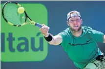  ?? AL DIAZ/TNS ?? Jack Sock returns a shot during his 6-2, 6-1 win over Jared Donaldson during Tuesday’s fourth round match at the Miami Open.