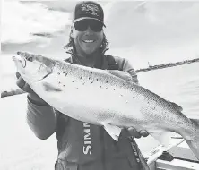 ?? COURTESY OF BRAD SMYTH ?? Brad Smyth made a rare catch May 10 on the Detroit River when he reeled in a 9- pound, 10- ounce Atlantic salmon.